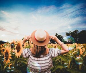 woman happy in sunflower field