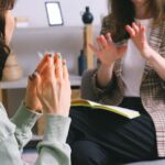 photo of woman across from her therapist in a session