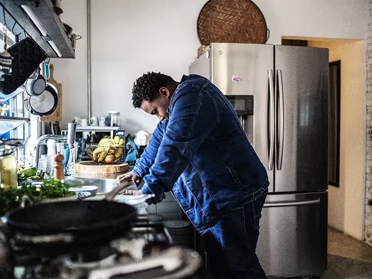 stressed man in kitchen